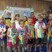 Summer Reading Program participants display their dragon masks